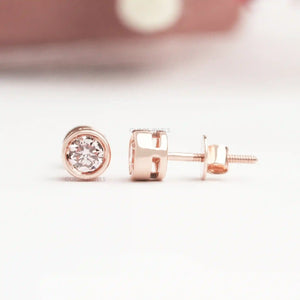 Bezel Set Diamond Stud Earrings in rose gold, featuring a secure screw back design and radiant round diamonds.