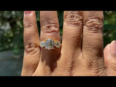 three stone engagement ring yellow gold 