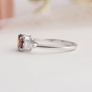 Side look of round and bullet cut lab made diamond three stone engagement ring