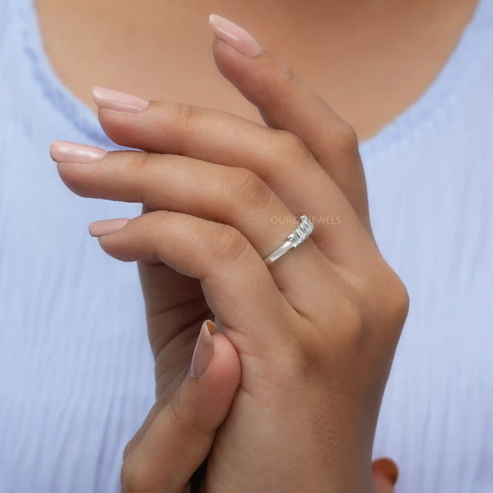 In finger side look of emerald lab made diamond wedding band