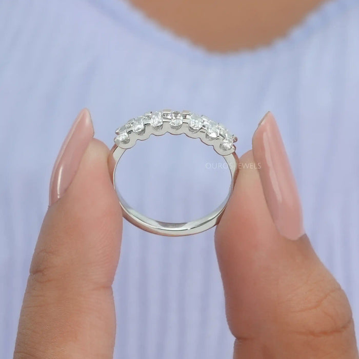 VVS clarity diamond engagement ring with oval cut lab diamonds in finger