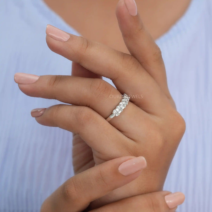 In finger side look of oval shape seven stone diamond engagement ring