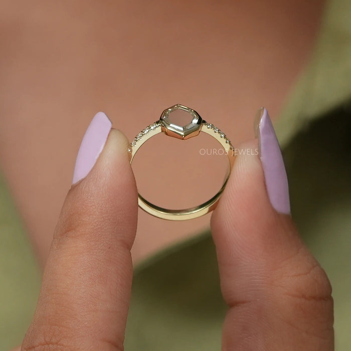 A close up look of antique oval diamond ring