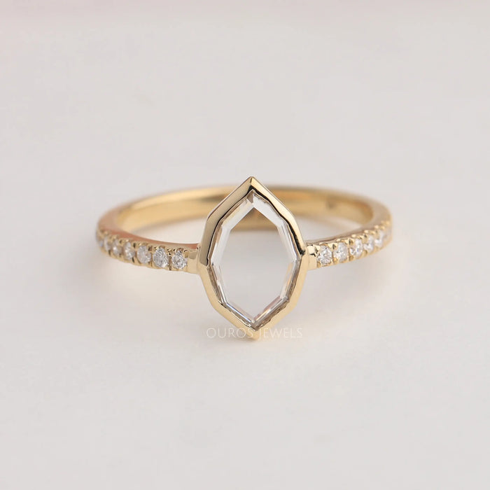 Step cut oval lab made diamond engagement ring with round accent stones in solid gold