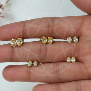 oval diamond stud earring in yellow gold 