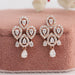 A stunning pair of eco friendly diamond earrings made with pear shape diamonds with halo of round diamonds