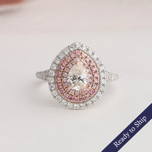 Pear shaped triple halo lab grown diamond engagement ring in 14k rose and white gold