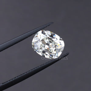 old mine cushion cut lab diamond holded with tweezer