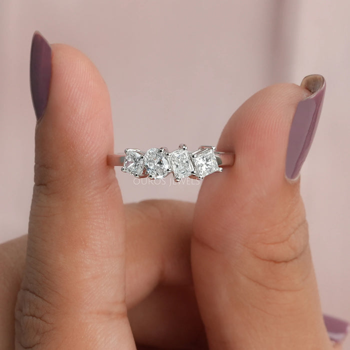 A close up look of four stone princess cut diamond ring