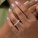 In finger front look of oval shaped yellow diamond wedding band