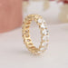 Side look of prongs and oval brilliant cut lab diamonds in eternity band