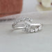 Curved bypass set diamond engagement ring with pear brilliant cut lab made diamond designed in 14kt white gold