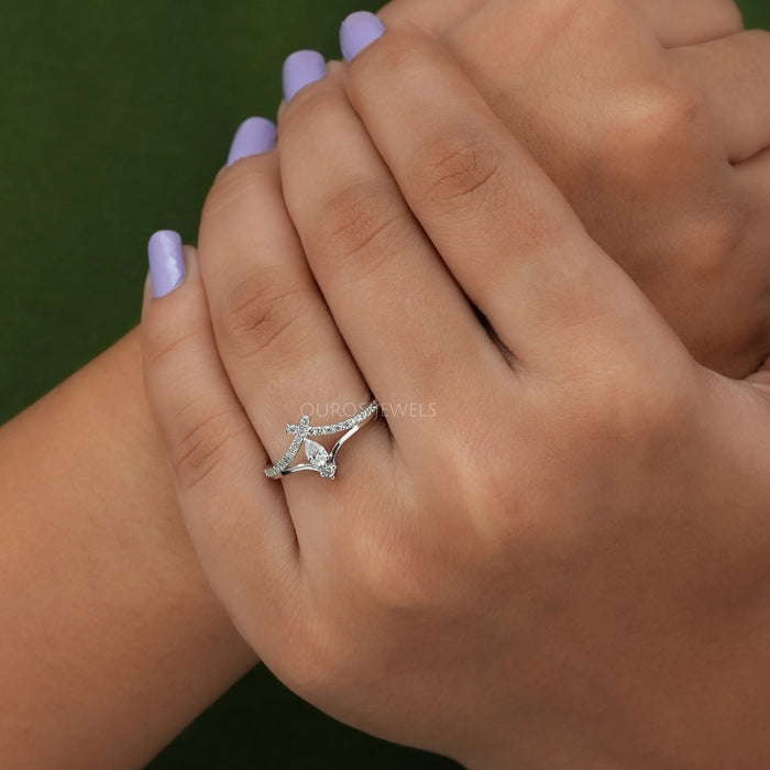 The pear diamond curved style ring is a stunning piece of jewelry perfect for an engagement or anniversary gift.
