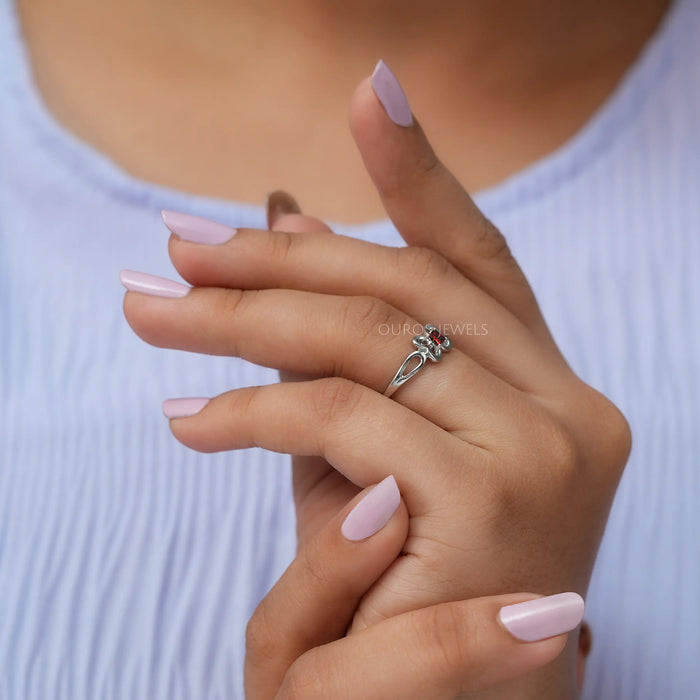 In finger side look of butterfly shaped lab diamond engagement ring