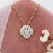 flower shaped halo diamond pendant