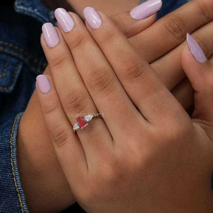 In finger front look of fancy pink radiant cut lab made diamond engagement ring