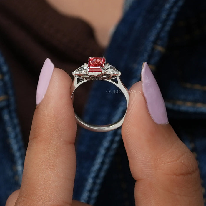 Close up look of pink radiant 3 stone diamond ring