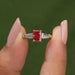 Close up look of pink radiant and tapered baguette cut three stone engagement ring