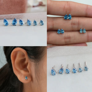 Collage Image of Blue Pear Shaped Diamond Stud Earrings.