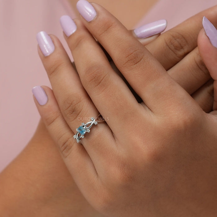 Fancy blue radiant lab created diamond infinity ring in finger