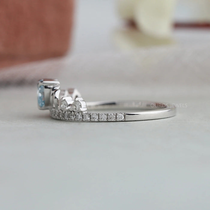 Round accent stones of blue heart shaped  lab grown diamond engagement ring 