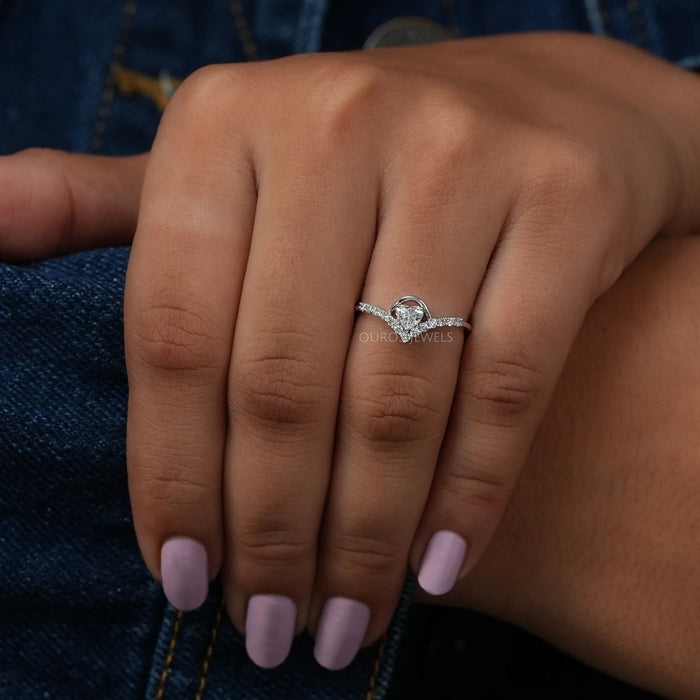This heart shaped white gold ring symbol of love & partnership. crafted with curved band with side round diamonds.