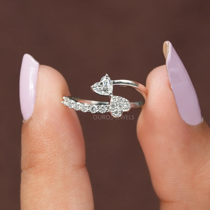 A close up look of Double heart bypass dainty ring