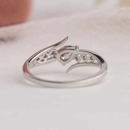 Back view of pear diamond ring with 14k white gold. This engagement ring set in bypass.