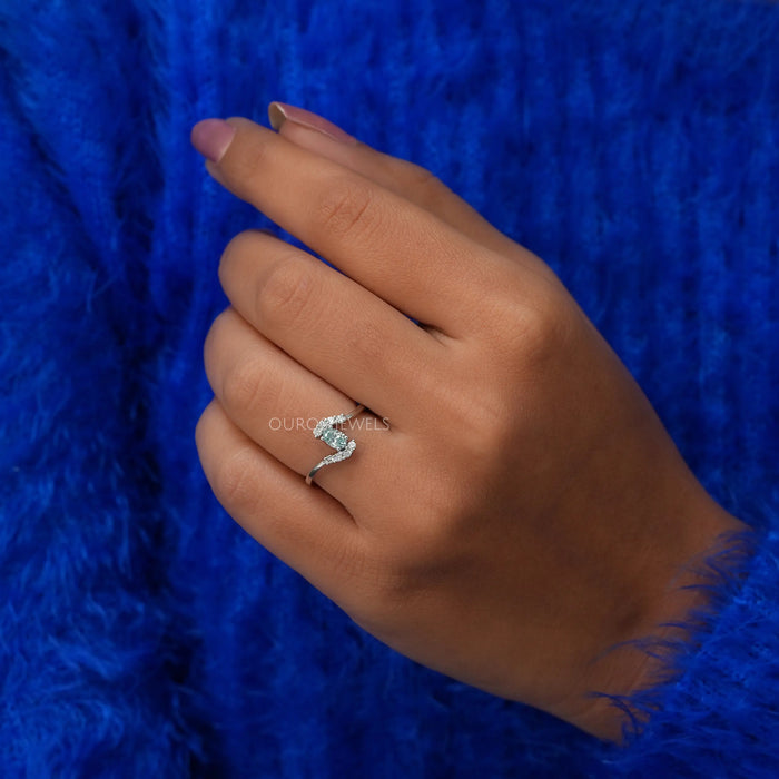 In finger front look of oval shaped diamond engagement ring in 14k white gold.