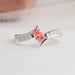 Close up view of oval cut diamond set in engagement ring in 14k white gold.