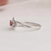 Side view of cushion cut cluster diamond ring center stone red color with VS clarity. Crafted with 14k white gold & set in split shank.