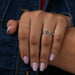 Front finger view of cushion cut cluster diamond ring in 4k white, inspired by vintage & wedding ring.