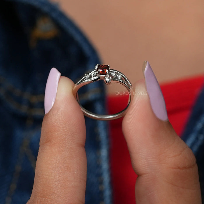 In two finger front view of cushion shaped cluster diamond ring in 14k white gold. Best choice for to gift someone.