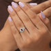 In finger look of oval engagement ring with halo