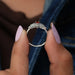 Cluster setting of oval cut diamond ring in white gold