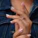 [On Finger Side View Of Fancy Pink Lab Diamond Three Stone Engagement Ring]-[Ouros Jewels]