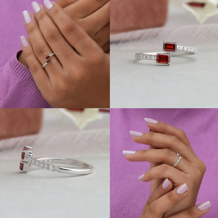 This ring features two emerald-cut red stones that are set in an intricately designed band made of high-quality gold
