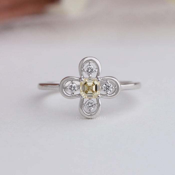 Front view of Antique shape asscher cut ring, features center stone asscher cut yellow color with VS clarity.