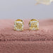 A pair of yellow gold earrings featuring sparkling diamonds, perfect for formal occasions or everyday wear