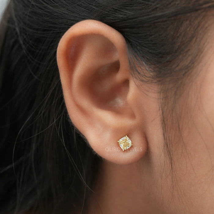 Shining yellow cushion lab created diamond solitaire studs with VS clarity brilliant cut diamonds 