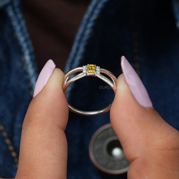 A close look of fancy yellow emerald shaped lab made diamond ring