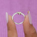 A close up look of shining pear shaped solitaire diamond engagement ring with a stylish curved shank